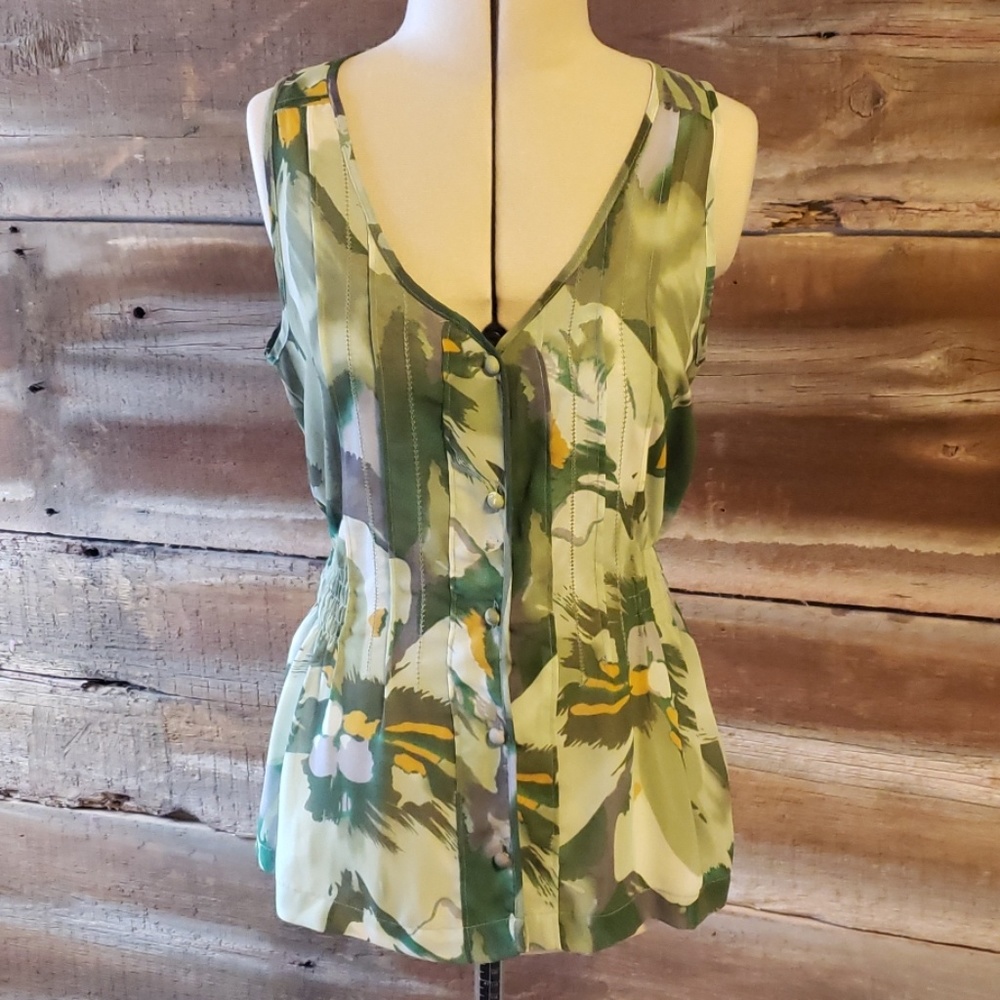 Sleeveless, button up sheer blouse